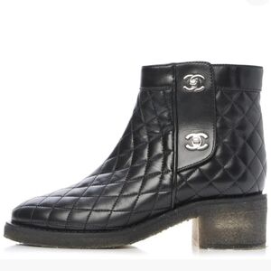 CHANEL Black Quilted Leather Ankle Booties With Iconic CC Turnlock.